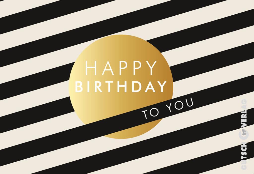 Eine Geburtstagskarte mit schwarz-weißen Diagonalstreifen und einem goldenen Kreis in der Mitte mit der Aufschrift „Happy Birthday to you“.